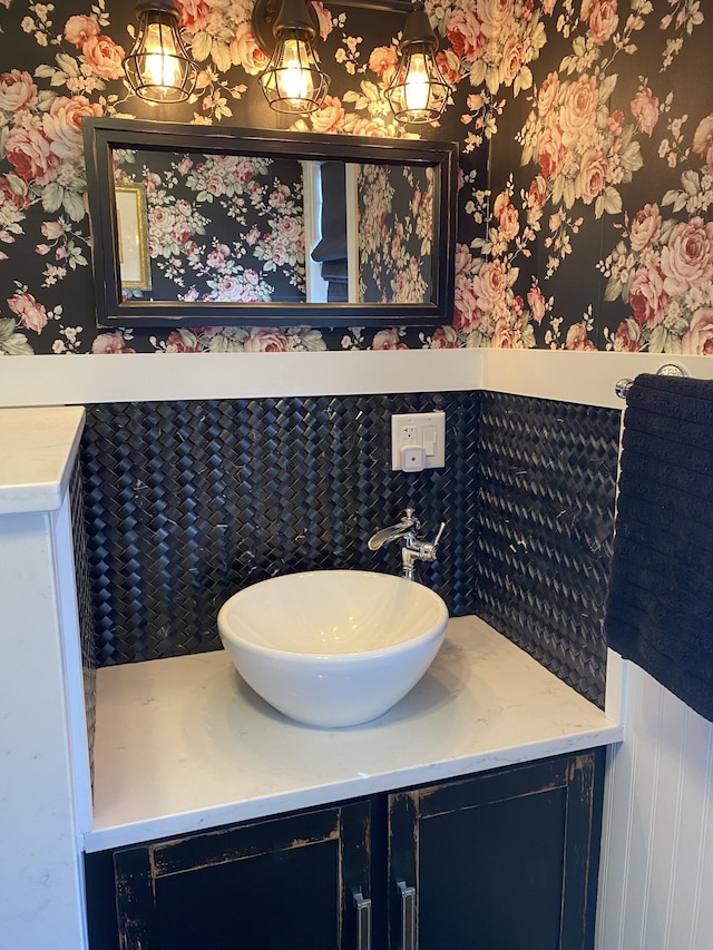 60 St John Rd, Fort Kent, ME 04743 - bathroom featuring wallpapered walls, vanity, and wainscoting