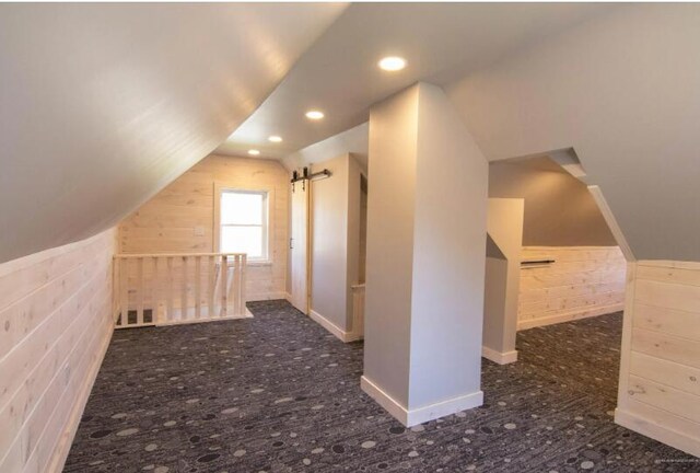60 St John Rd, Fort Kent, ME 04743 - additional living space with lofted ceiling, wooden walls, and recessed lighting