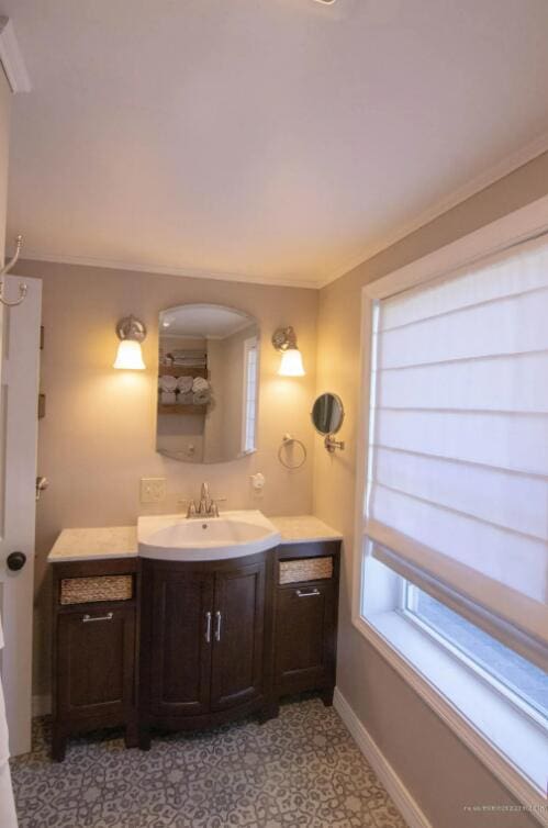 60 St John Rd, Fort Kent, ME 04743 - bathroom featuring baseboards, vanity, tile patterned floors, and crown molding