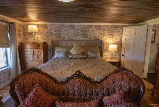 60 St John Rd, Fort Kent, ME 04743 - bedroom featuring wallpapered walls, wood finished floors, and wood ceiling