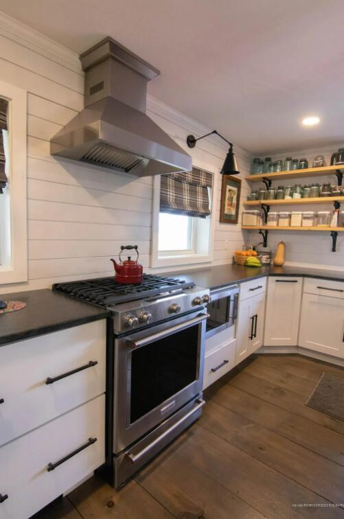 60 St John Rd, Fort Kent, ME 04743 - kitchen with appliances with stainless steel finishes, island exhaust hood, open shelves, crown molding, and dark wood finished floors