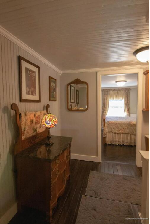 60 St John Rd, Fort Kent, ME 04743 - hallway featuring crown molding and dark wood-type flooring