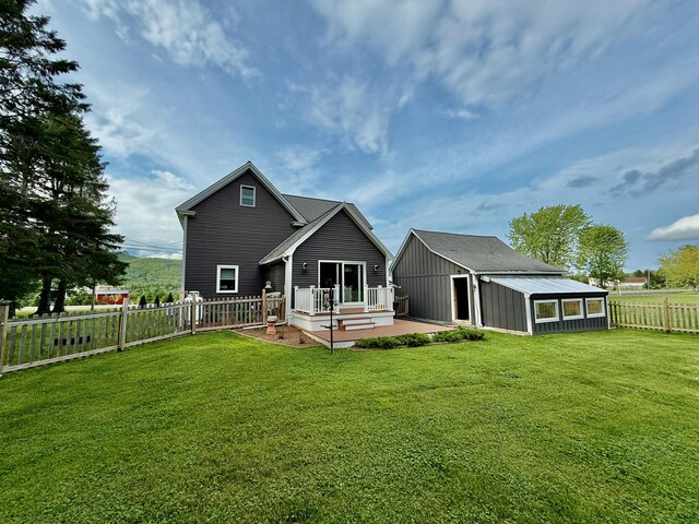 60 St John Rd, Fort Kent, ME 04743 - rear view of property featuring an outbuilding and a deck
