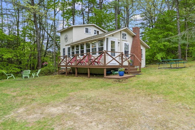 19 Pond View Way, Casco, ME 04015 - rear view of property featuring a chimney, a deck, and a yard