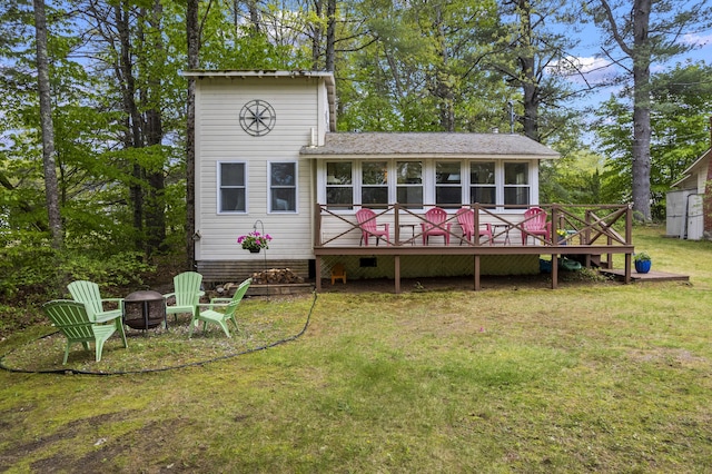 19 Pond View Way, Casco, ME 04015 - back of property with an outdoor fire pit, a deck, a yard, and a sunroom