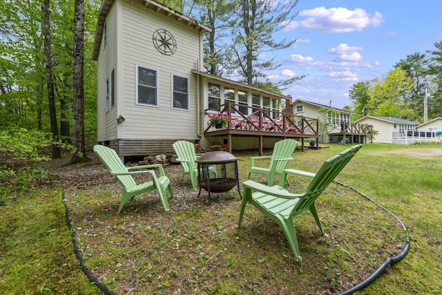 19 Pond View Way, Casco, ME 04015 - rear view of property featuring a fire pit, a deck, and a lawn