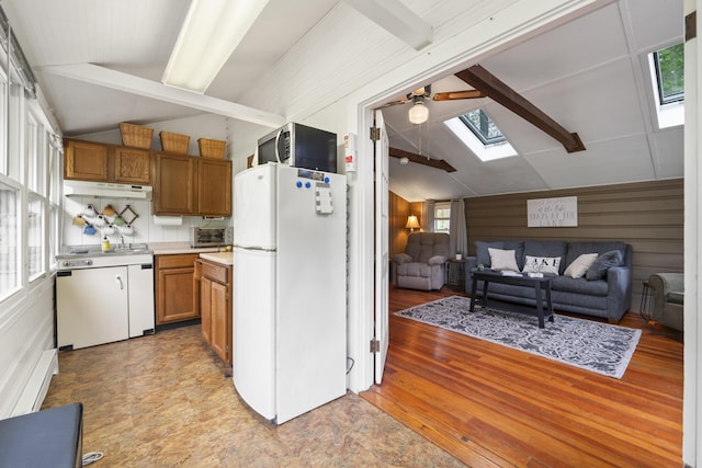 19 Pond View Way, Casco, ME 04015 - kitchen with freestanding refrigerator, a skylight, under cabinet range hood, stainless steel microwave, and a ceiling fan
