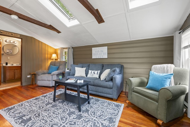 19 Pond View Way, Casco, ME 04015 - living room featuring a skylight, wood finished floors, and wooden walls