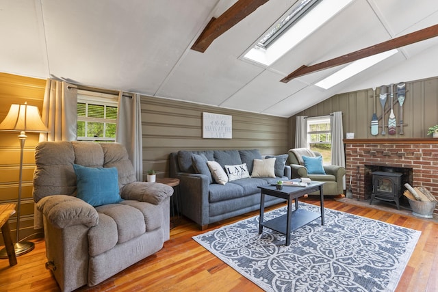 19 Pond View Way, Casco, ME 04015 - living room with a wood stove, a skylight, and wood-type flooring