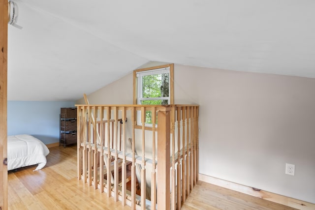 19 Pond View Way, Casco, ME 04015 - staircase with wood finished floors, vaulted ceiling, and baseboards