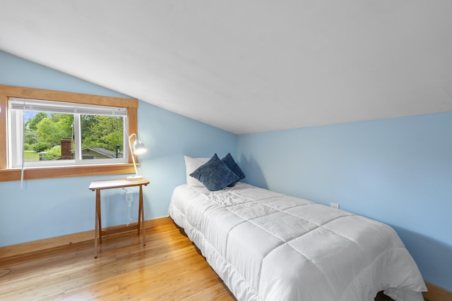 19 Pond View Way, Casco, ME 04015 - bedroom featuring vaulted ceiling and wood finished floors