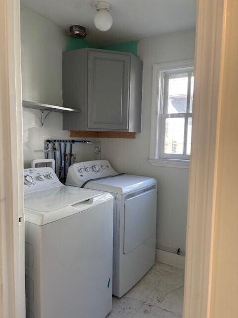 laundry room featuring washer and dryer and cabinet space