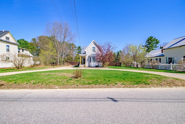 traditional home featuring curved driveway