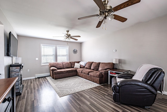 living area with dark wood finished floors, a ceiling fan, and baseboards