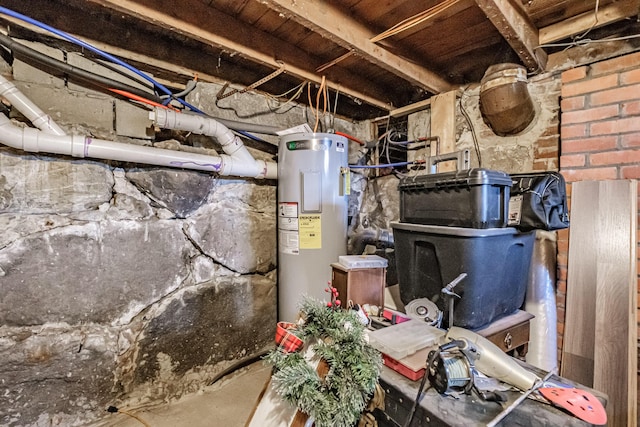 unfinished below grade area featuring water heater