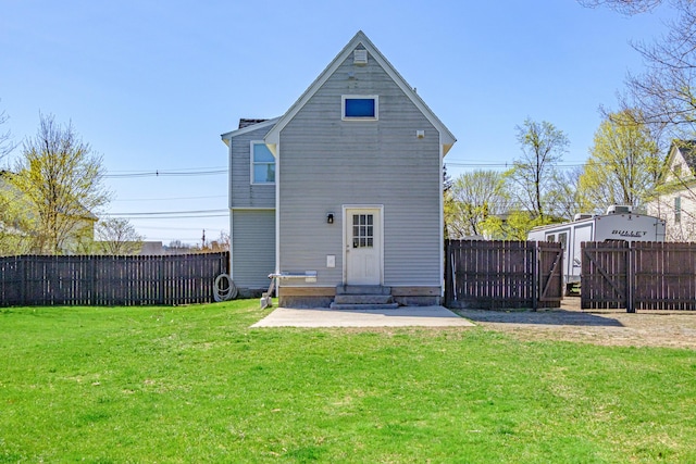 rear view of property featuring entry steps and a patio