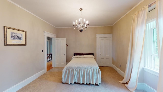 carpeted bedroom featuring a chandelier, crown molding, and baseboards