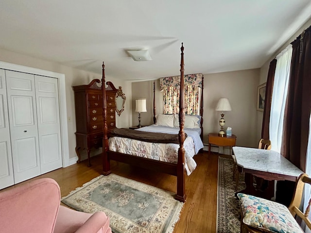 bedroom featuring a closet and wood finished floors