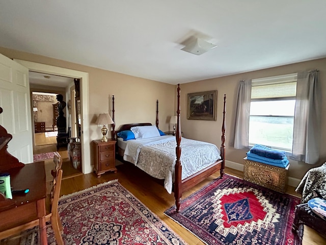 bedroom with wood finished floors