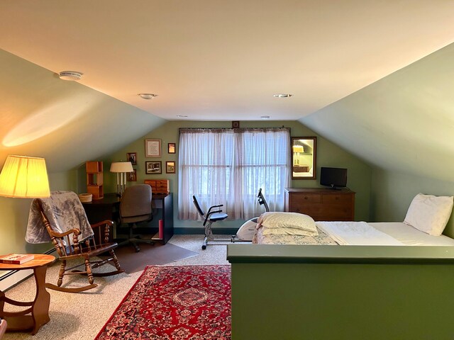 carpeted bedroom featuring lofted ceiling