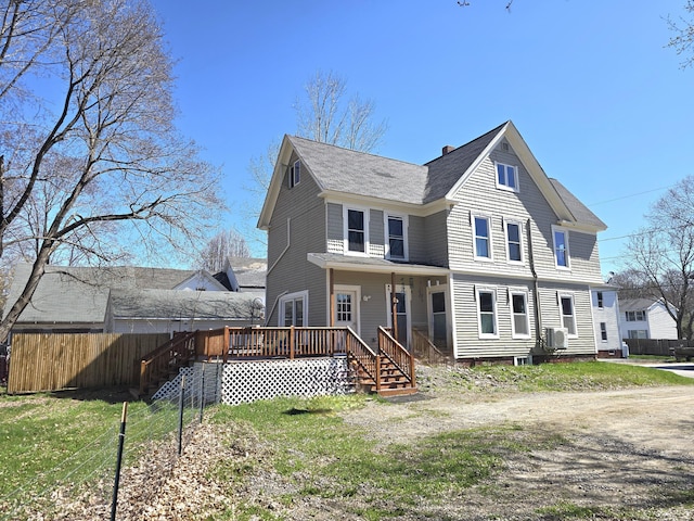 10 Middle St, Lisbon, ME 04252 - view of front of property featuring fence, a shingled roof, and a deck