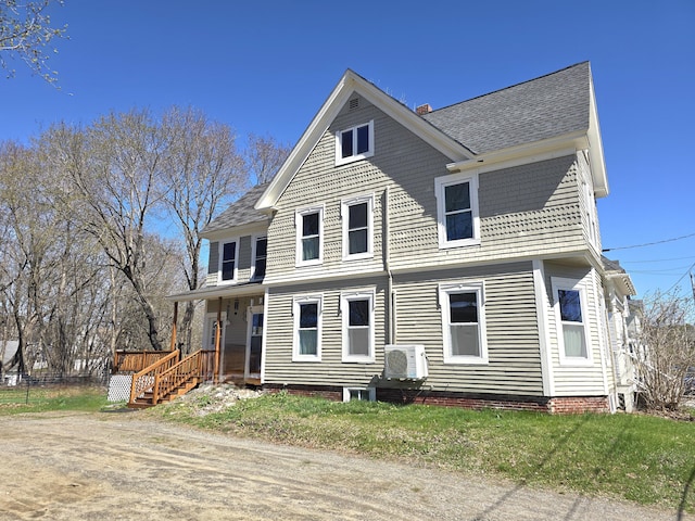 10 Middle St, Lisbon, ME 04252 - rear view of house with a shingled roof, ac unit, and covered porch