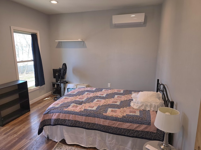 10 Middle St, Lisbon, ME 04252 - bedroom with baseboards, a wall unit AC, recessed lighting, and wood finished floors