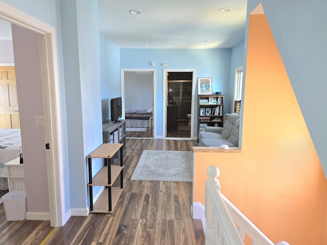 10 Middle St, Lisbon, ME 04252 - hallway featuring baseboards, recessed lighting, dark wood finished floors, and an upstairs landing