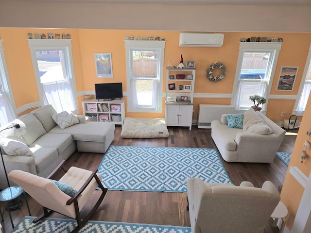 10 Middle St, Lisbon, ME 04252 - living room featuring a wall unit AC and wood finished floors