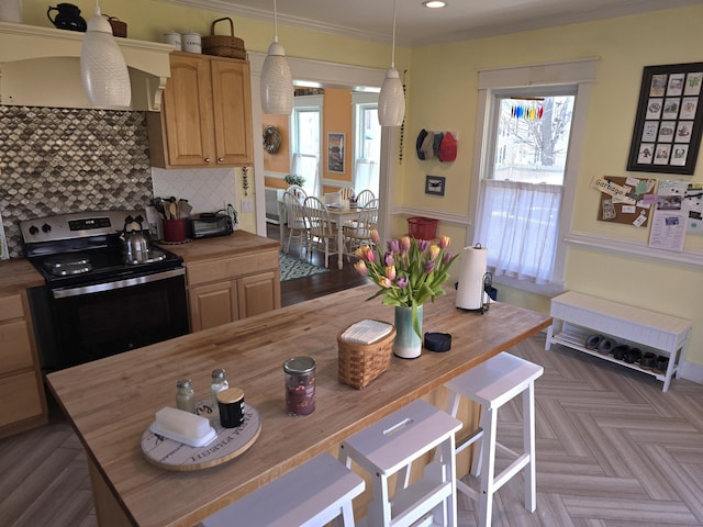 10 Middle St, Lisbon, ME 04252 - kitchen featuring crown molding, hanging light fixtures, tasteful backsplash, stainless steel electric stove, and butcher block countertops