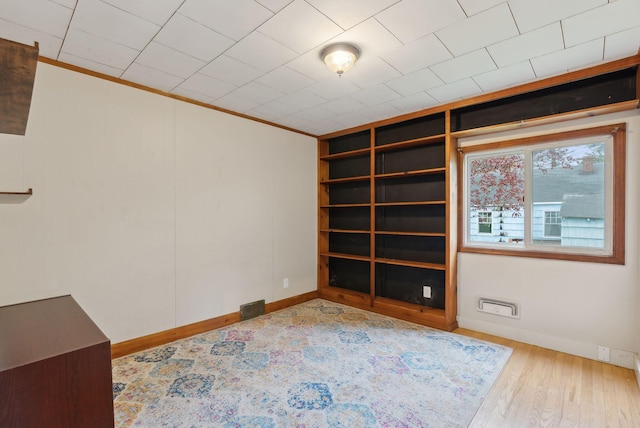 61 Westmore Ave, Biddeford, ME 04005 - unfurnished room with baseboards, crown molding, and wood finished floors