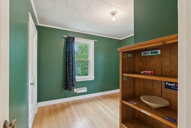 61 Westmore Ave, Biddeford, ME 04005 - bedroom with crown molding, wood finished floors, and baseboards
