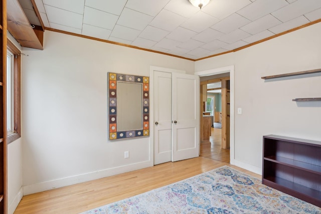 61 Westmore Ave, Biddeford, ME 04005 - bedroom featuring ornamental molding, wood finished floors, and baseboards
