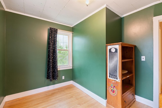 61 Westmore Ave, Biddeford, ME 04005 - unfurnished room with ornamental molding, wood finished floors, and baseboards