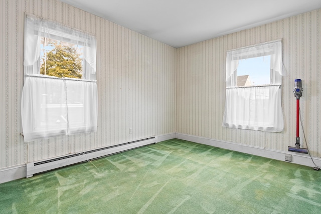 carpeted spare room with baseboard heating and wallpapered walls