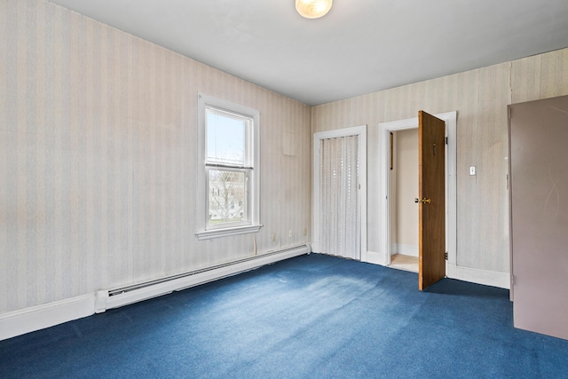 unfurnished bedroom with wallpapered walls, baseboard heating, and dark carpet
