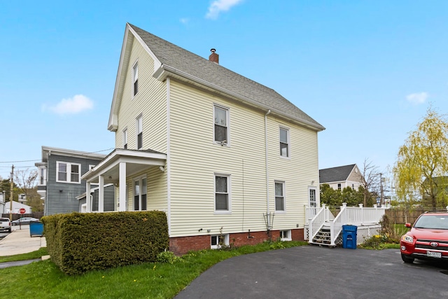 view of home's exterior with a chimney