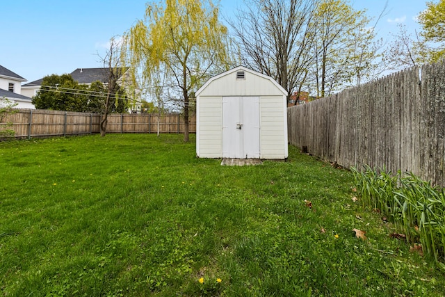 view of shed featuring a fenced backyard