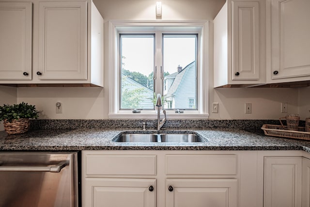 kitchen featuring a sink, dishwasher, and white cabinets