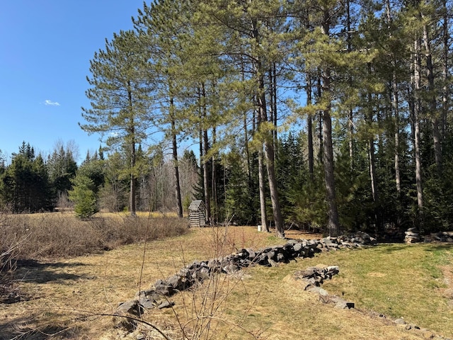 view of landscape featuring a wooded view