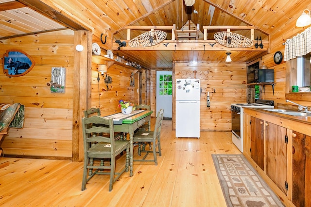 kitchen with wooden walls, wood ceiling, light wood-type flooring, and white appliances