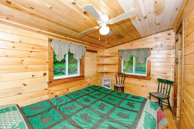 bedroom with wooden walls, wood ceiling, and multiple windows