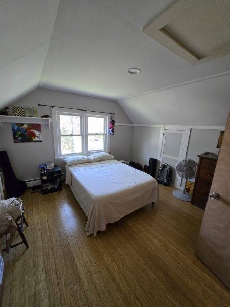 9 Allen Avenue Ext, Falmouth, ME 04105 - bedroom featuring lofted ceiling and wood finished floors