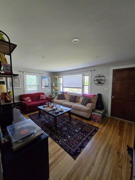 9 Allen Avenue Ext, Falmouth, ME 04105 - living area featuring wood finished floors and a healthy amount of sunlight