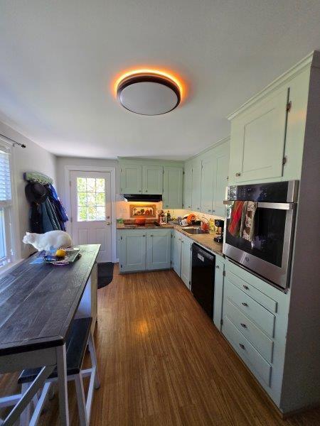 9 Allen Avenue Ext, Falmouth, ME 04105 - kitchen featuring dishwasher, dark wood-type flooring, exhaust hood, and stainless steel oven