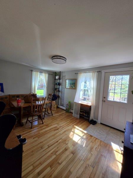 9 Allen Avenue Ext, Falmouth, ME 04105 - dining space with hardwood / wood-style floors and a healthy amount of sunlight