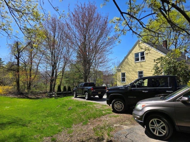 9 Allen Avenue Ext, Falmouth, ME 04105 - view of home's exterior with a yard and a chimney