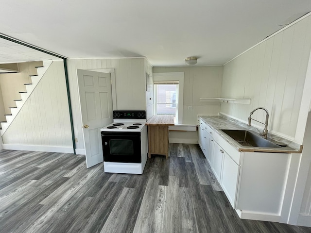 kitchen featuring a sink, light countertops, white cabinets, electric range, and dark wood finished floors