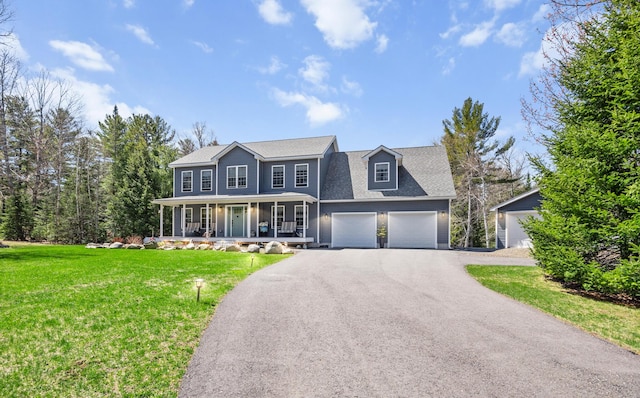 35 Graystone Dr, Hampden, ME 04444 - colonial inspired home featuring a shingled roof, an attached garage, a front yard, covered porch, and driveway