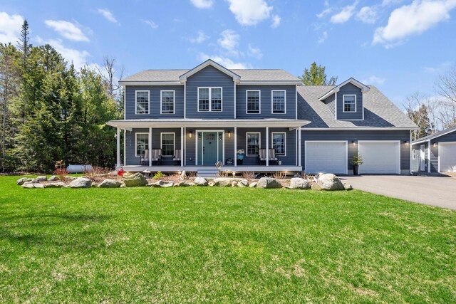 35 Graystone Dr, Hampden, ME 04444 - colonial-style house featuring a porch, driveway, roof with shingles, a front lawn, and an attached garage